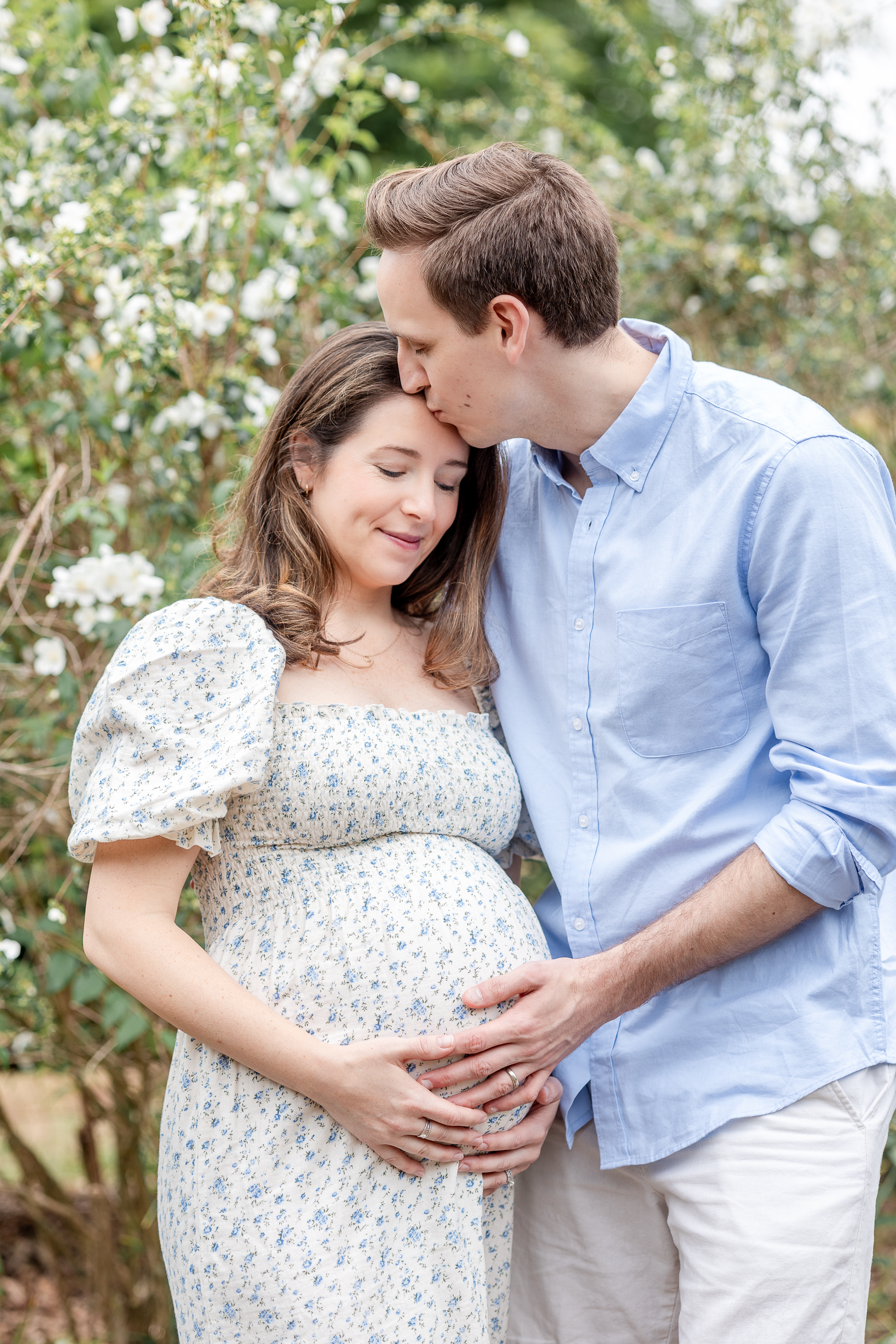 Expectant mother smiling outdoors
